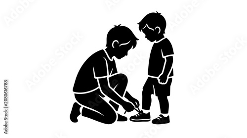 Father teaching son to tie shoes.