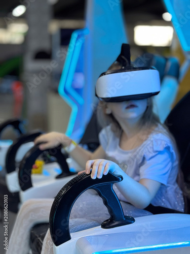 A girl enjoys the fully immersive virtual reality experience at a modern entertainment center.
