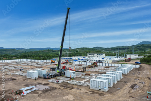 Large-Scale Battery Energy Storage Station Under Construction with Crane Lifting Modular Units