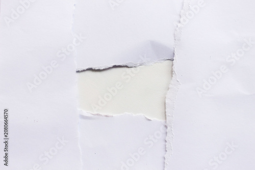 White torn paper pieces on a white background