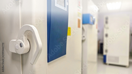 Selective focus of ultra low temperature -70 degree celsius freezer for keeping specimens for laboratory testing in hospital.Front of refrigerator storage blood from patient for research in university