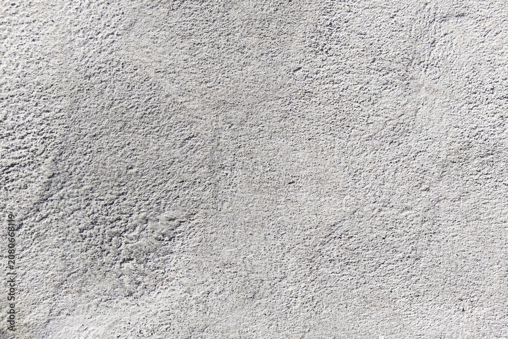 Fototapeta premium Gray concrete wall texture background. Rough cement surface backdrop.
