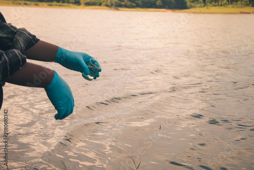 Environmental technicians conducting water sampling to support pollution control.