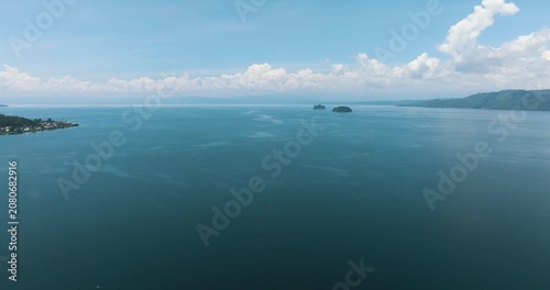Beautiful landscape with lake and two small island. Lake Lanao. Mindanao, Philippines.