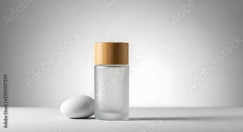 Glass bottle with wooden cap and stone.