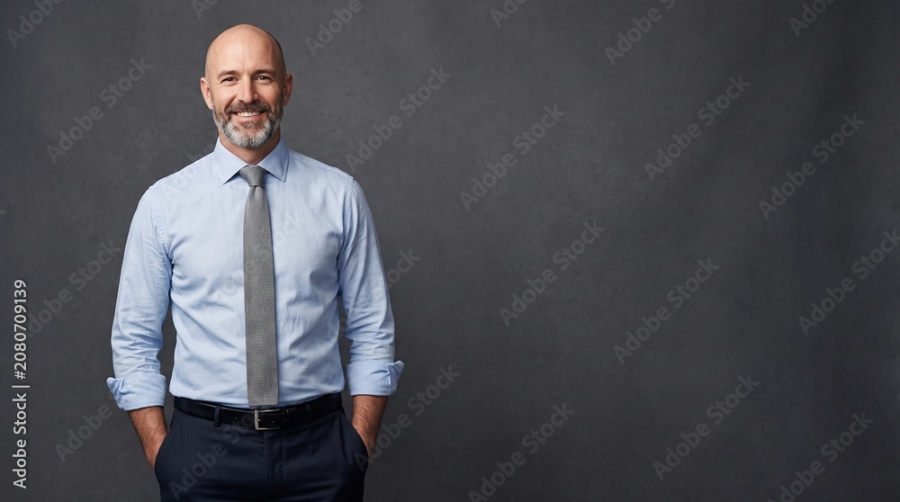 Obraz premium Confident Middle-Aged Businessman Professional Studio Portrait