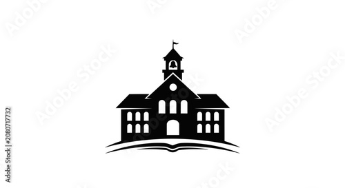 Silhouette of a schoolhouse building with open book graphic in black and white