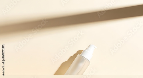 Frosted cosmetic pump bottle on beige background with natural shadow