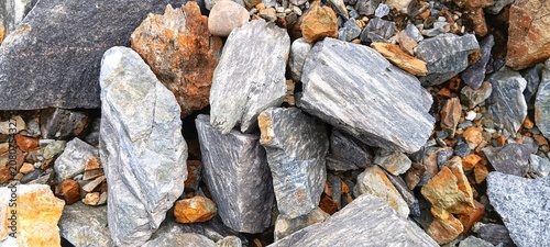 Bild auf Leinwand Close up background texture of split mountain stones for durable building constr