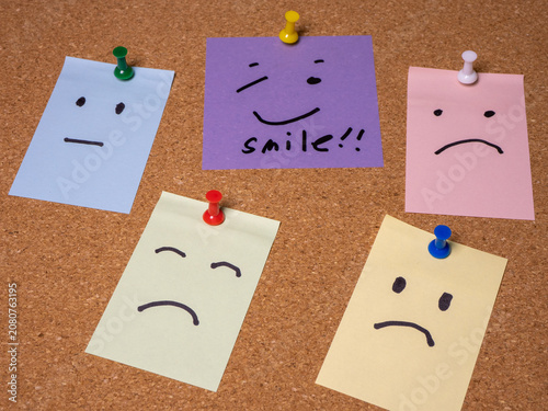 This purple sticky note features a hand-drawn smiley face and the encouraging word 