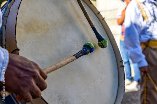 Close-up of a drum being played during Congado festivities in Minas Gerais.
