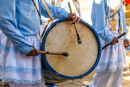 Rustic wooden drums during a Congado group parade in Minas Gerais.