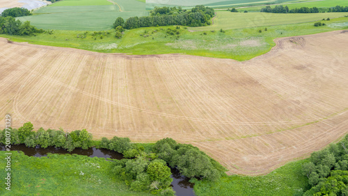 Aerial View of Meandering River and Farmland in Lithuania