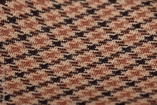 Close-Up Houndstooth Woven Wool Fabric Texture in Brown and Beige Tones