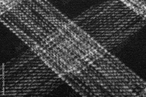 Dark Wool Fabric Texture Close-Up Macro with Black and White Plaid Checkered Pattern Background