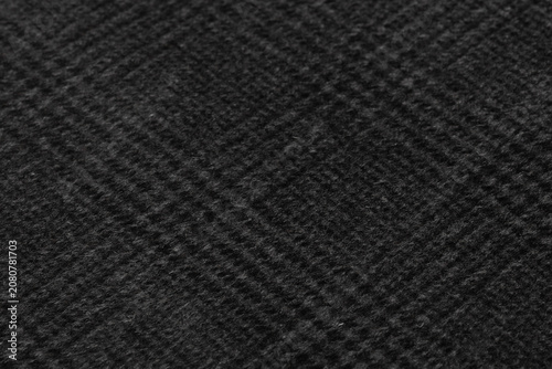 Dark Charcoal Black Wool Fabric Texture Close-Up Macro with Subtle Herringbone Weave Pattern Background