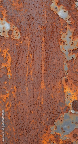 A close-up of a corroded metal surface with orange rust and gray patches