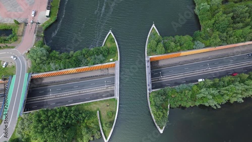 Aerial view of traffic driving through the Aqueduct Veluwemeer, a navigable water bridge connecting two parts of a lake