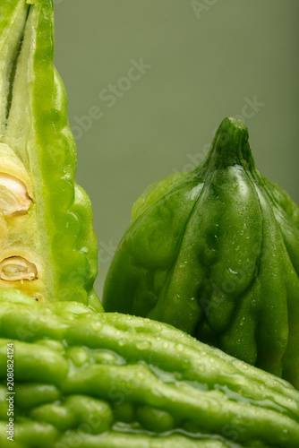Принти на полотні Bitter gourd on a green background