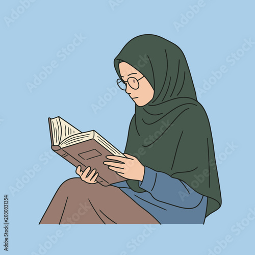 A young woman wearing a green hijab reads a book quietly