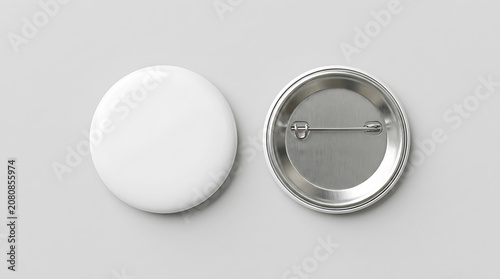 Two blank white and silver pin badges on a light gray background 1