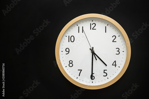 Wall clock showing four thirty. 16:30