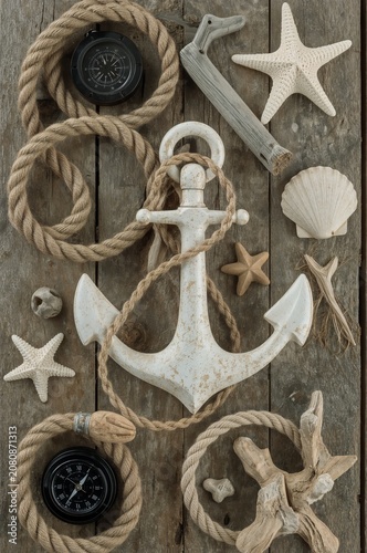 Decorative Anchor and Marine Objects Arranged on a Wooden Surface During Dayl...