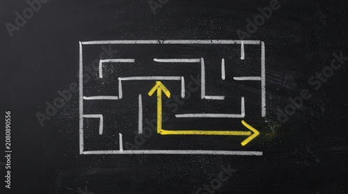 A chalk-drawn maze with a yellow arrow showing a clear path out, symbolizing problem-solving and finding solutions.