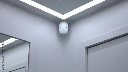Static Shot Of A Sleek Wireless Device In A Minimalist Office Hallway With Soft Lighting