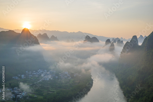 Sunrise over Karst Mountains and Misty River in Guilin, China