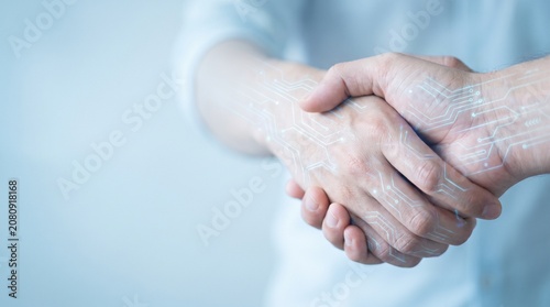 Future Business Collaboration and Digital Transformation Concept with Handshake and Glowing Circuit Board Overlay