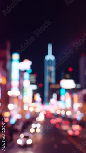 A Captivating Urban Nightscape Illuminated by Vibrant Neon Lights and Soft Bokeh Effects, Featuring a Majestic Skyline in the Background