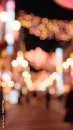 A Vibrant, Blurred Scene Capturing the Enchantment of City Life at Night, Showcasing Beautiful Lights and a Lively Atmosphere in a Bustling Urban Environment