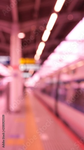 A Captivating Glimpse of a Train Station: Exploring the Dynamics of Movement and Anticipation in a Blurred Visual Journey