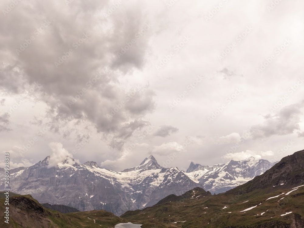 Obraz premium mountain road in the mountains, clouds over the mountains, lake in the mountains