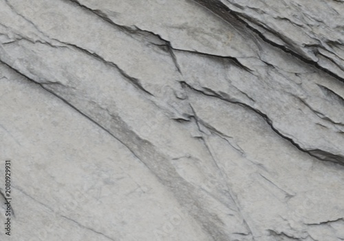 Light grey slate stone texture with diagonal lines. Natural rock backdrop.