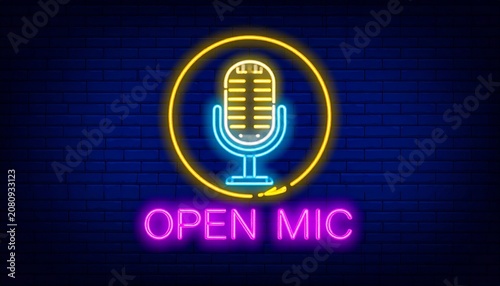 Glowing Neon Open Mic Sign with Vintage Microphone on a Dark Brick Wall