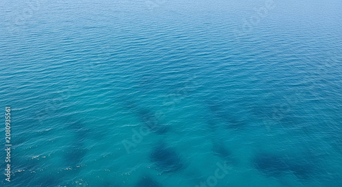 Deep blue sea ripples and underwater shadows from high altitude aerial perspective