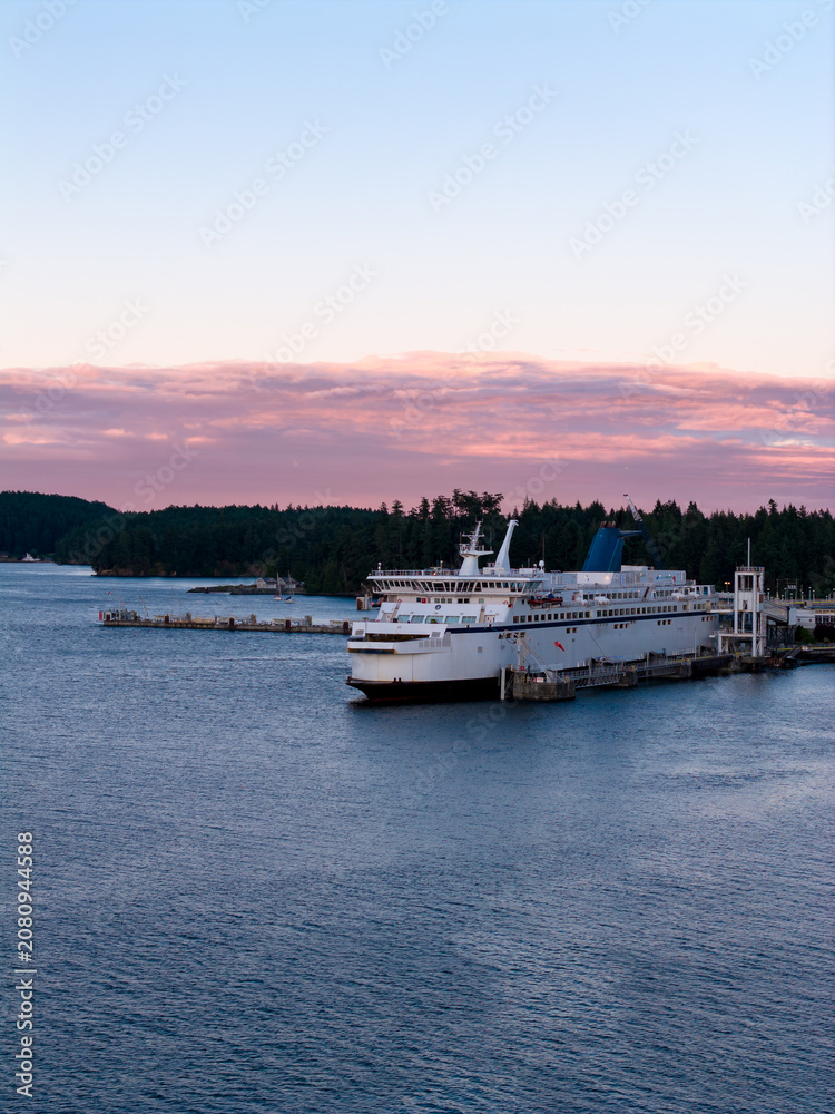 Fototapeta premium Ferry Docked at Swartz Bay With Pink Sunset Clouds Over Vancouver Island, British Columbia, Canada