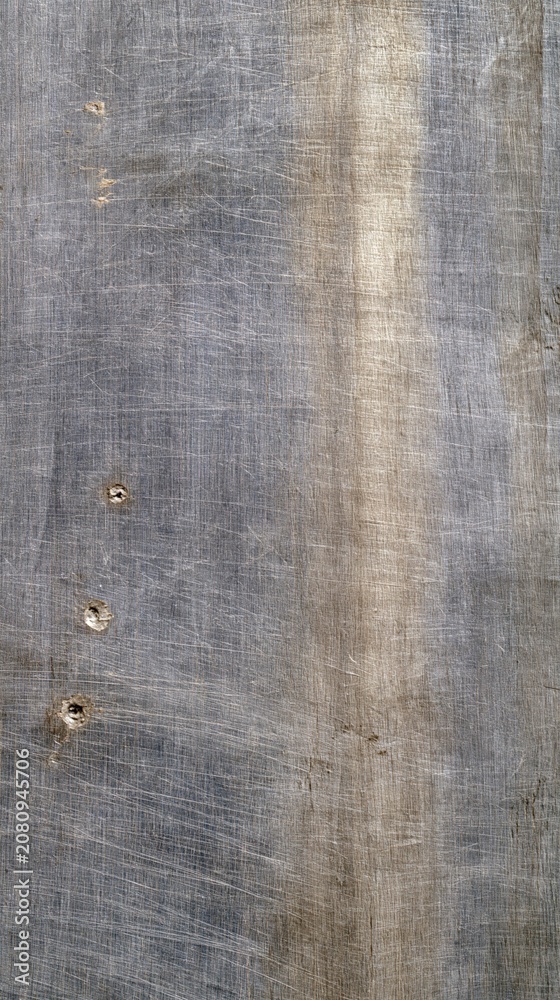 Fototapeta premium Wood panel showing scratches and nail holes in surface