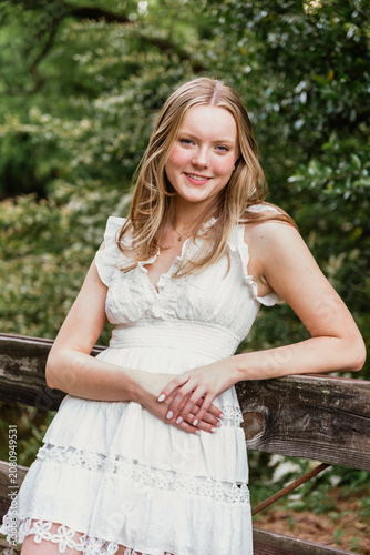 Portrait of a teen girl leaning on fence