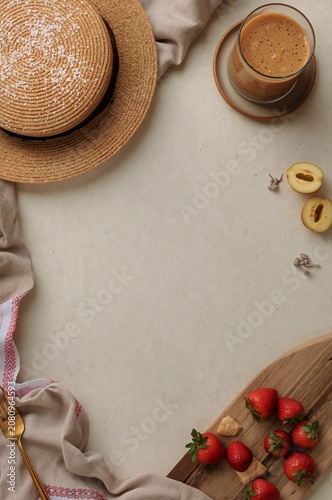 Enjoying Coffee With Fresh Strawberries and Peaches on a Beige Table