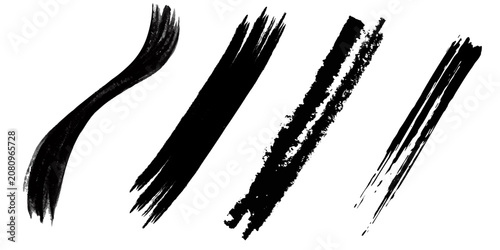 Black ink brush stroke texture with splatter effects on white background