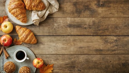 Morning Table With Croissants, Apples, Coffee and Muffins in a Cozy Setting
