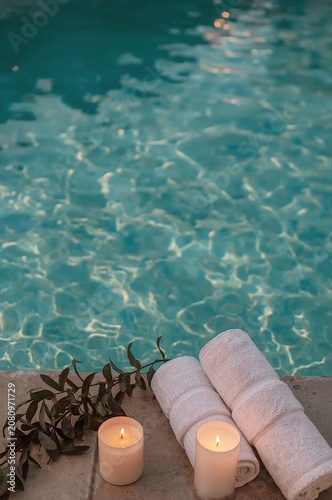 Relaxing by the Pool With Towels and Candles on a Warm Day