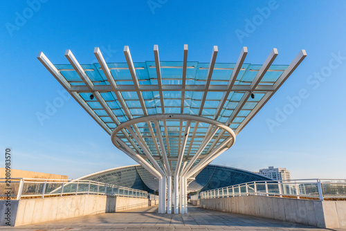 Modern Glass Canopy Walkway with Futuristic Architecture