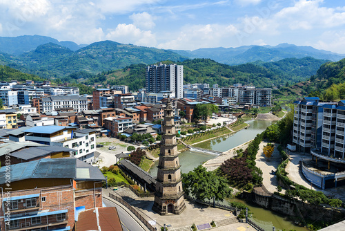Ancient pagoda over town and river in Liangping District, Chongqing, China