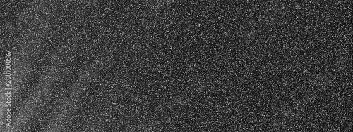 Fotografie Grainy noise texture with speckled pattern and slight gradient effect on a dark