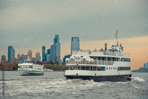 Bild auf Leinwand Two passenger ferries crossing Hudson River near Jersey City