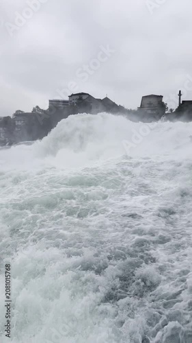 SCHAFFHAUSEN, SWITZERLAND - OCTOBER 11, 2025: View of the Rhine Falls with the powerful Rhine River flowing through the famous natural landmark.